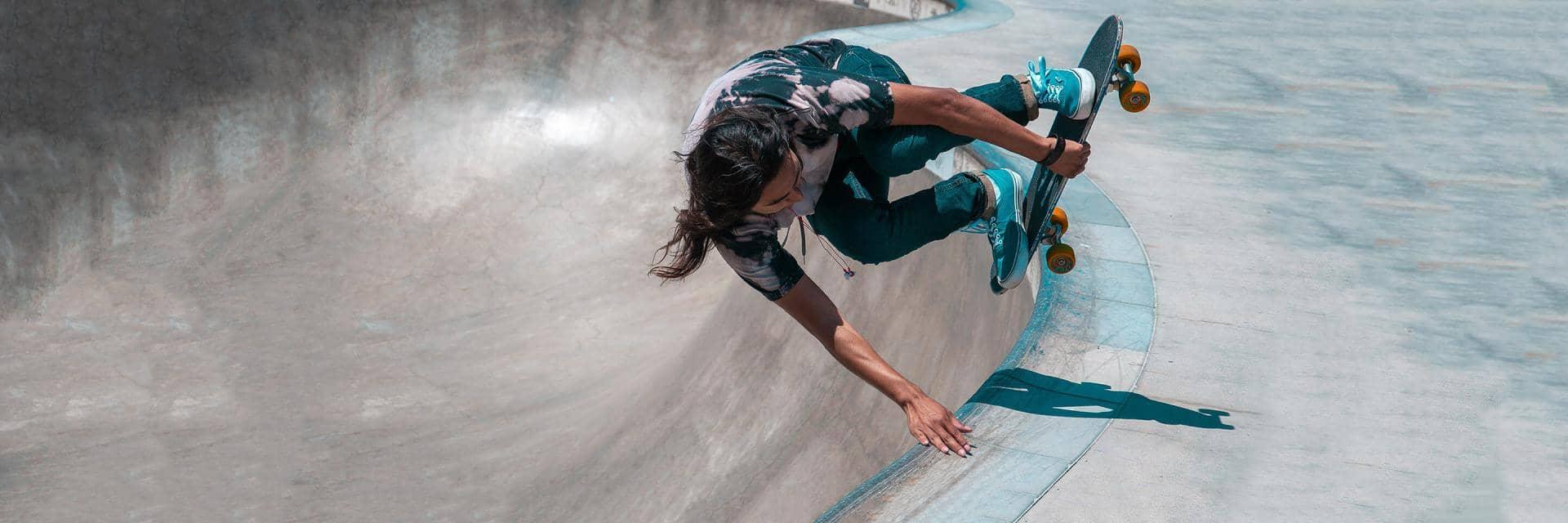 A skateboarder does a trick in a skatepark
