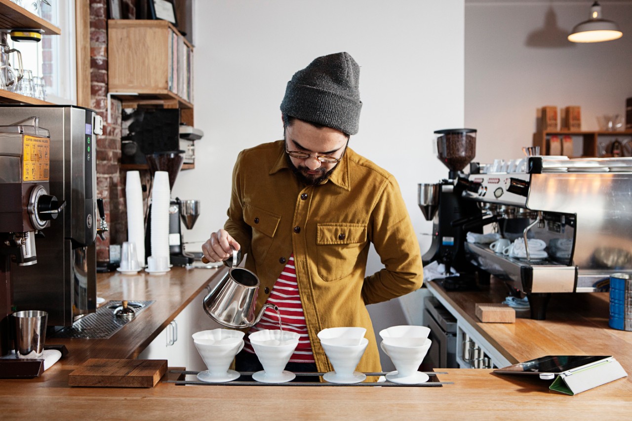 Barista pouring coffee