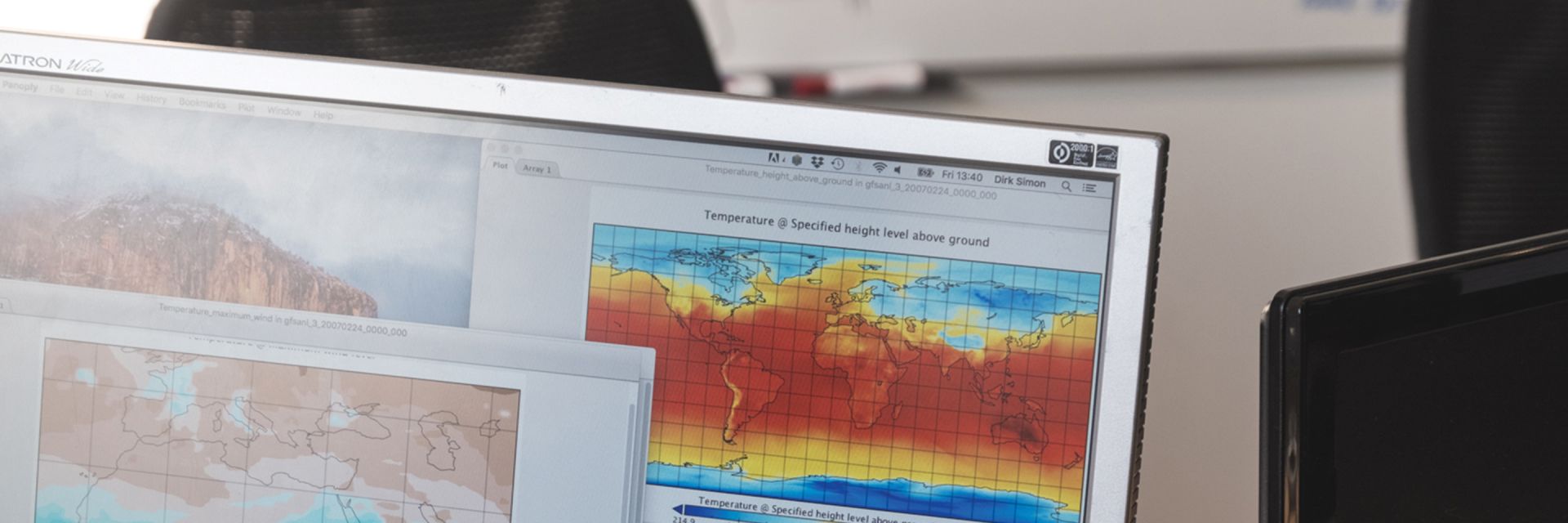 A corner of a computer screen displaying temperature data patterns across a map of the world