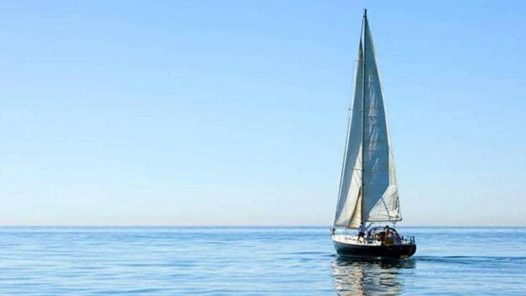 Sailing boat on calm water