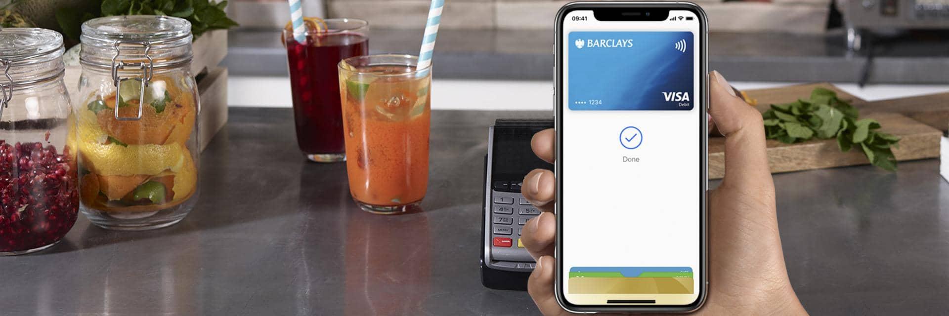 A phone screen using Apple Pay with a Barclays card to make a payment.