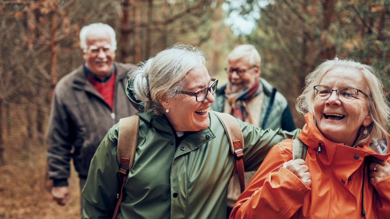  seniors hiking through the forest | Barclays